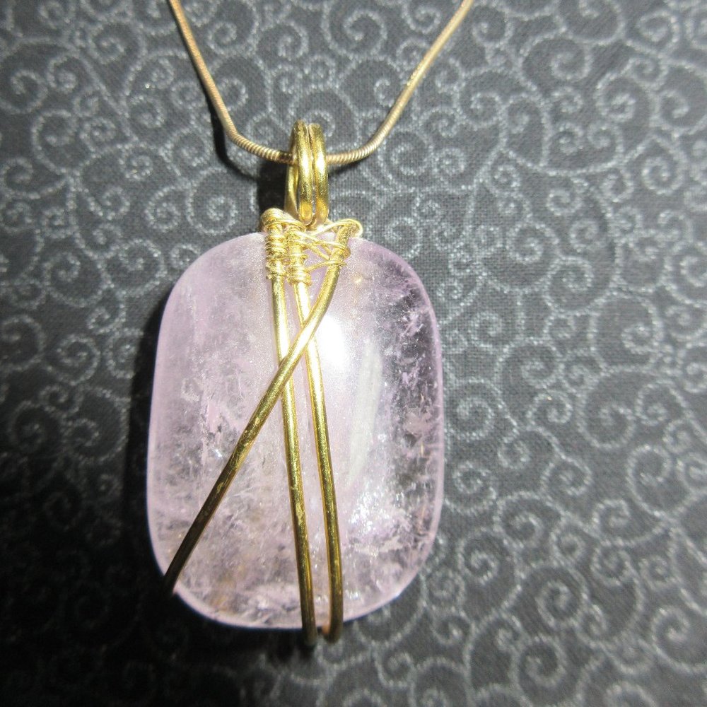 Necklace - 18 inches long - Purple stone wrapped in gold colored wire